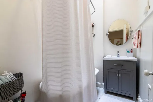 a kitchen with a stove a sink and a refrigerator