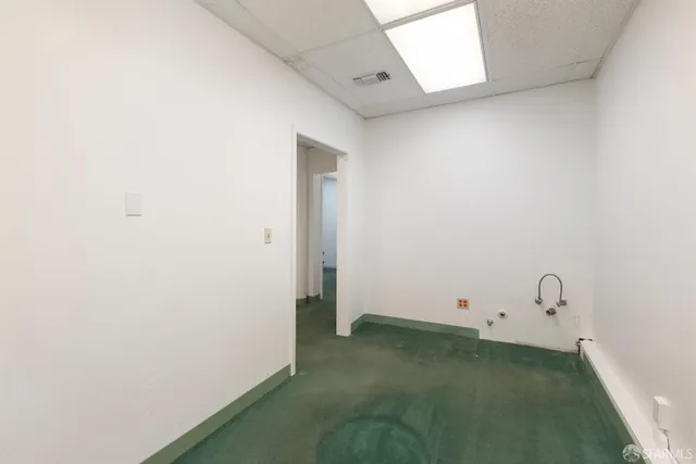 a bathroom with a toilet and a sink