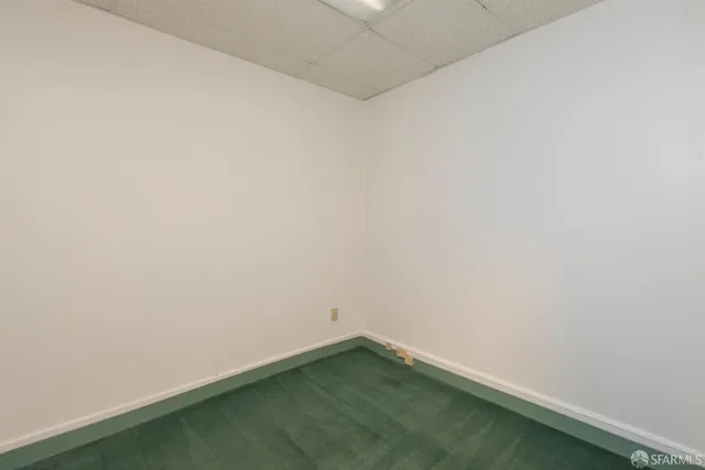 a front view of a house with parking space