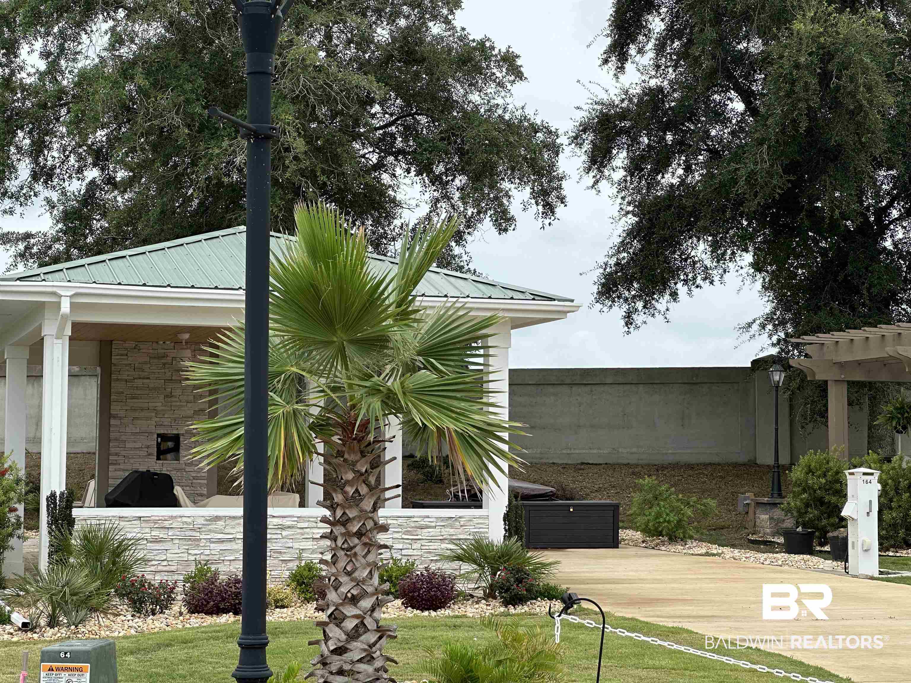 View of side of property featuring a yard