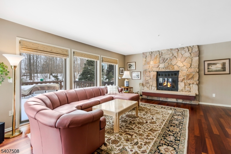 855 Sunset Ridge Bridgewater, NJ 08807 - Photo 11 of 39 a living room with furniture and a fireplace