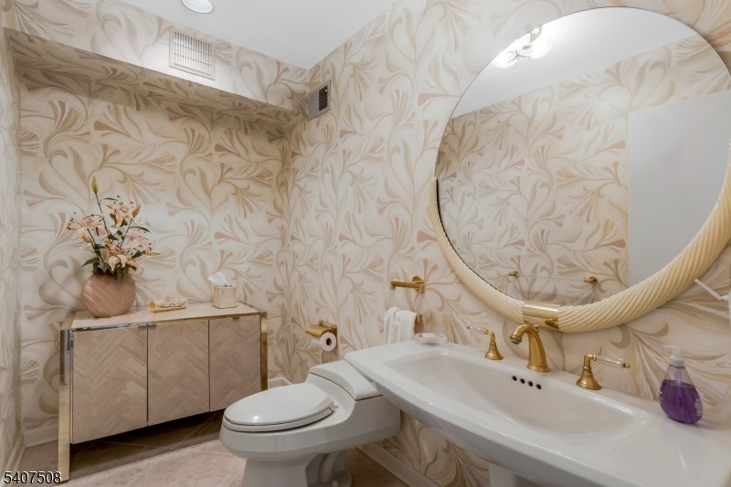 855 Sunset Ridge Bridgewater, NJ 08807 - Photo 13 of 39 a bathroom with a sink a toilet and a mirror