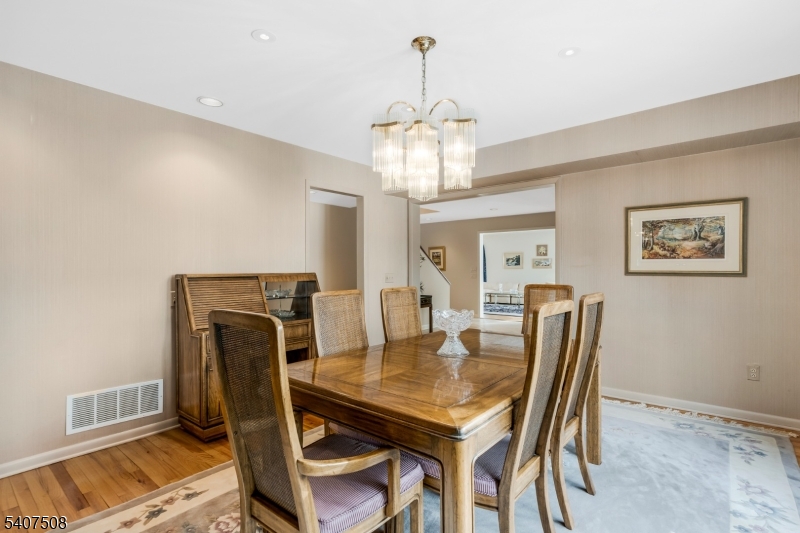855 Sunset Ridge Bridgewater, NJ 08807 - Photo 21 of 39 a view of a dining room with furniture and wooden floor