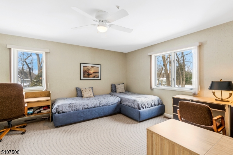855 Sunset Ridge Bridgewater, NJ 08807 - Photo 29 of 39 a living room with bed and a window