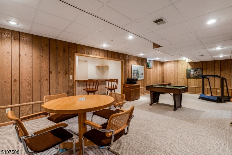 855 Sunset Ridge Bridgewater, NJ 08807 - Photo 32 of 39 a room with furniture a table and a projector