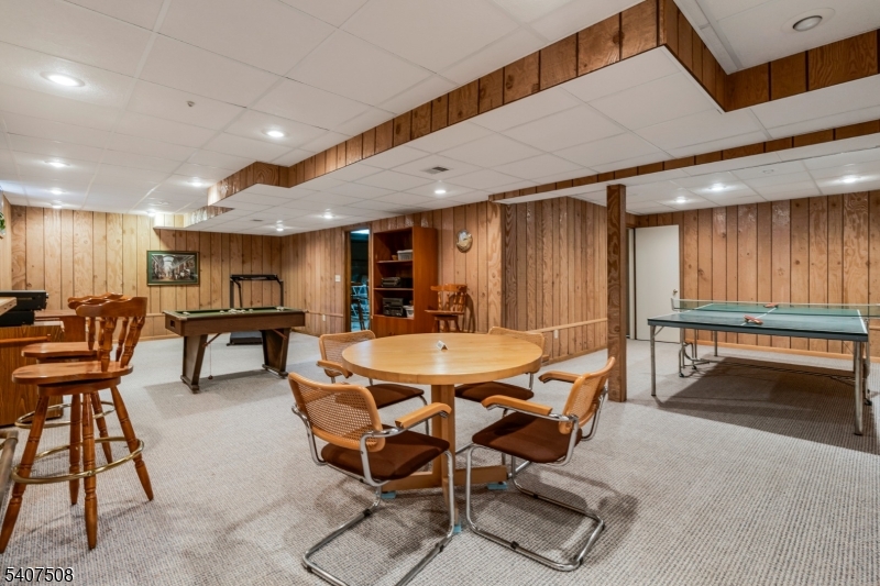 855 Sunset Ridge Bridgewater, NJ 08807 - Photo 33 of 39 a dining hall with stainless steel appliances a dining table and chairs with the view of kitchen
