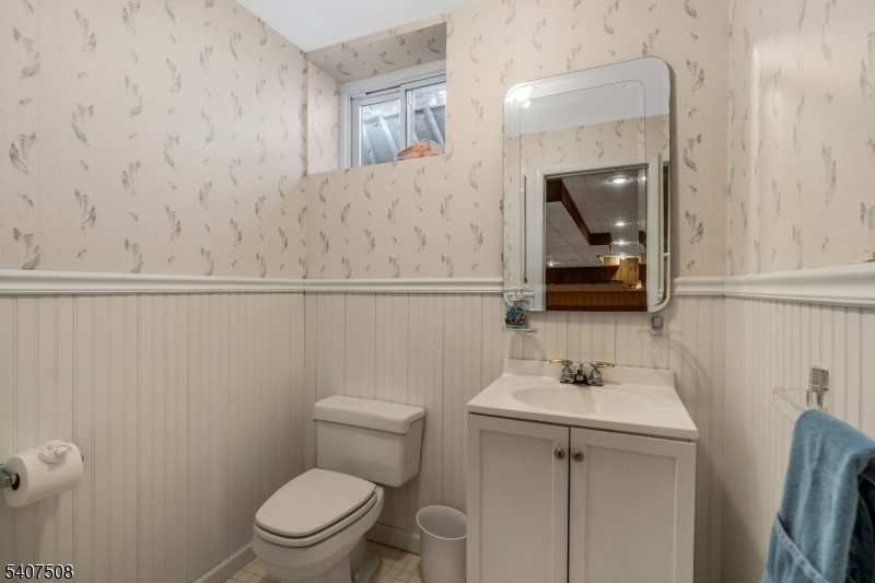 855 Sunset Ridge Bridgewater, NJ 08807 - Photo 34 of 39 a bathroom with a toilet a sink and mirror