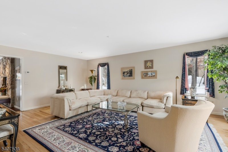 855 Sunset Ridge Bridgewater, NJ 08807 - Photo 8 of 39 a living room with furniture and a rug
