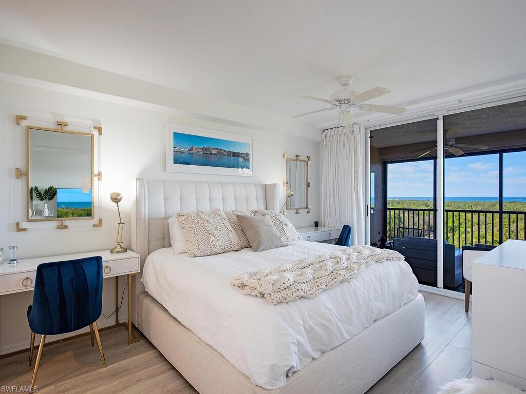 6825 Grenadier Boulevard, Unit 604 Naples, FL 34108 - Photo 7 of 12 a bedroom with a bed and a window