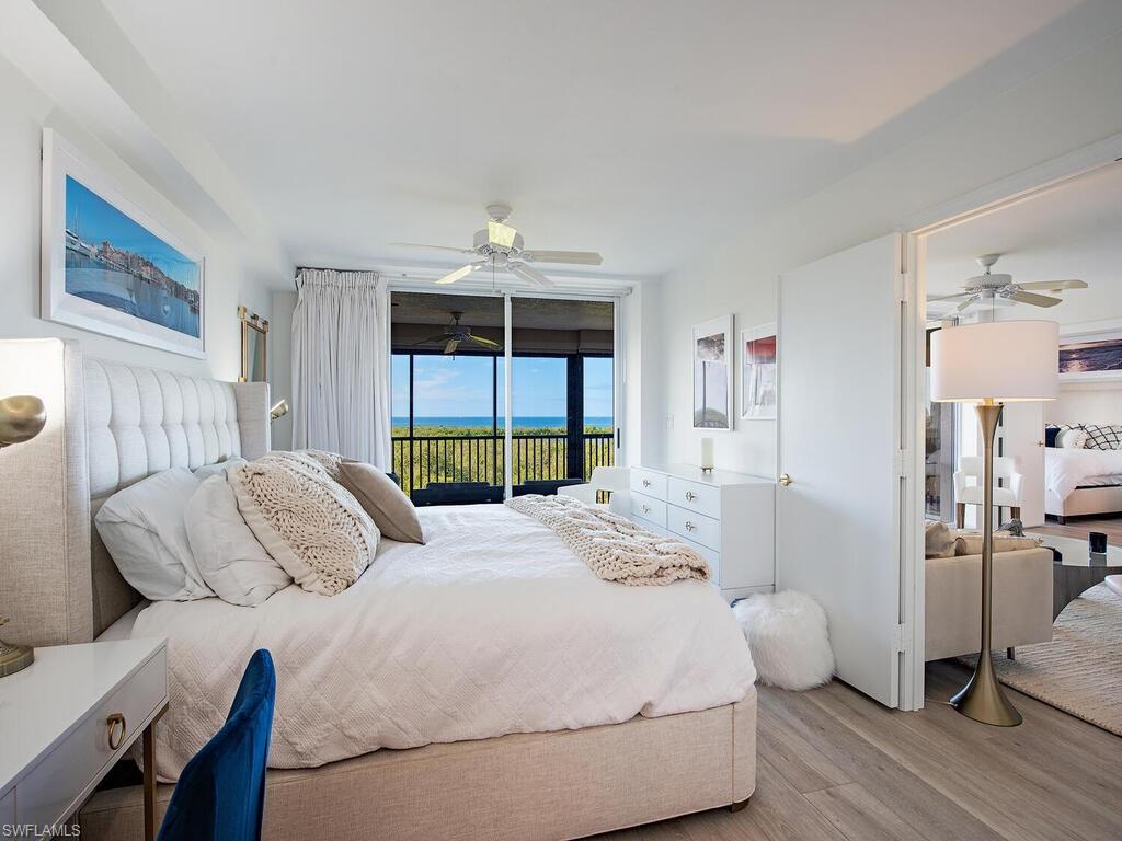 6825 Grenadier Boulevard, Unit 604 Naples, FL 34108 - Photo 8 of 12 a bedroom with a bed and window