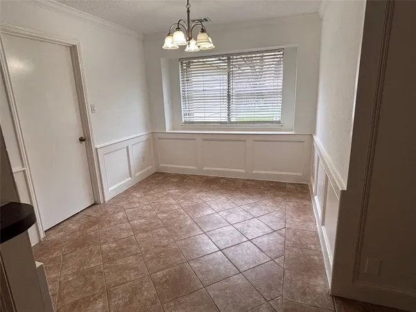 a view of empty room with windows