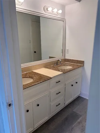 a room that has a dresser and a window