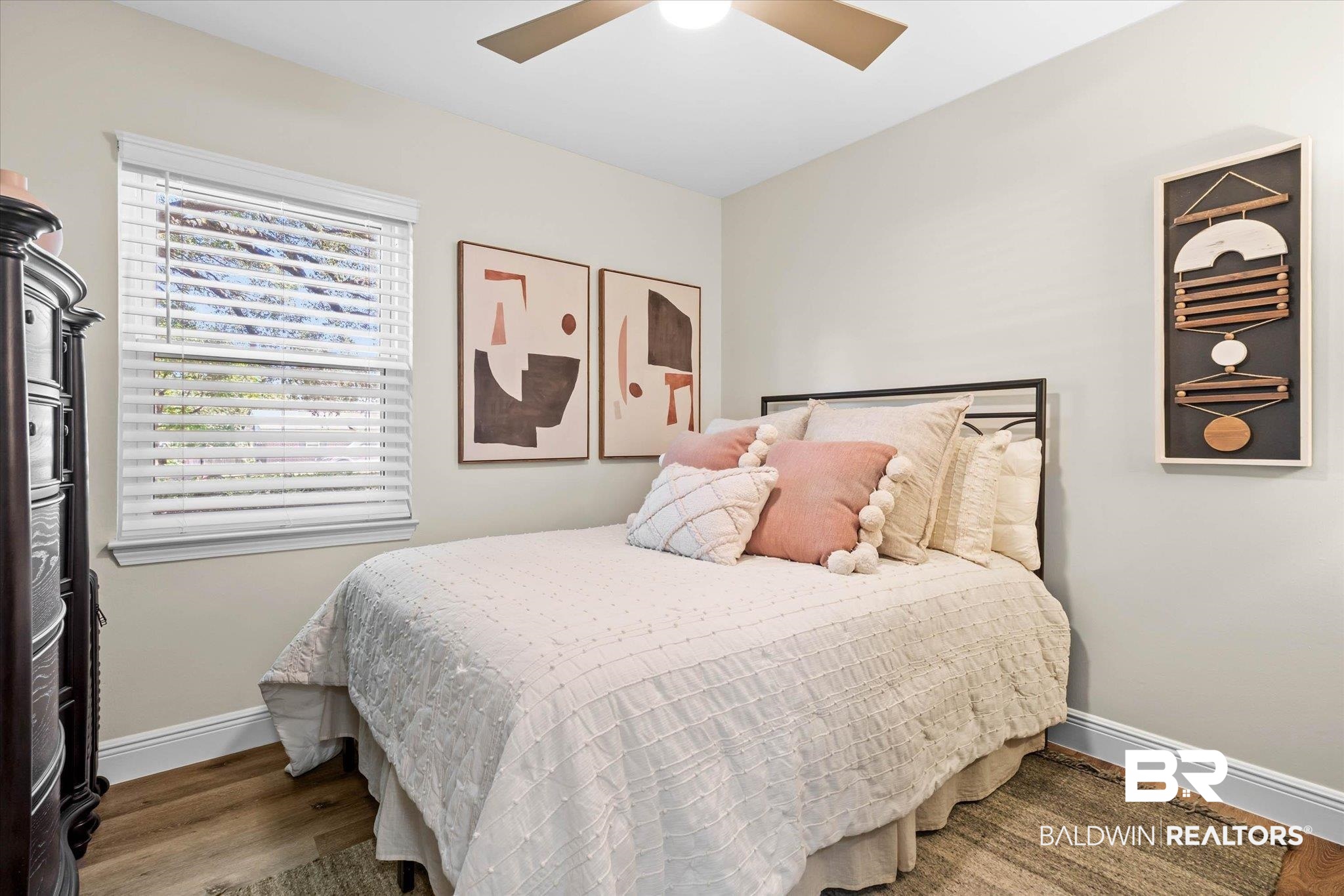 101 Ann Street Daphne, AL 36527 - Photo 20 of 38 Light-filled room featuring neutral wall paint and wood-finish flooring