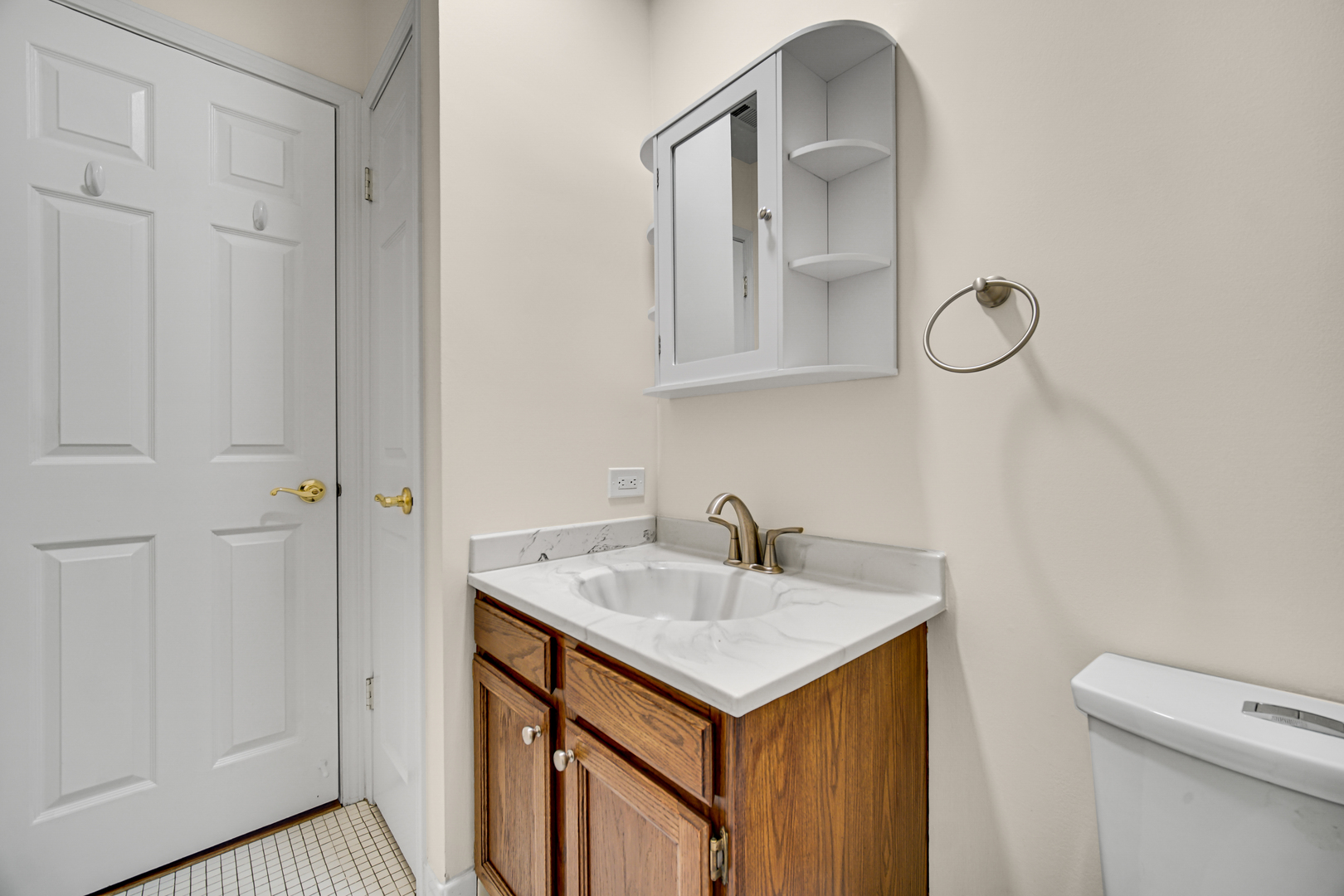 1130 Oakview Drive Wheaton, IL 60187 - Photo 13 of 25 a bathroom with a sink and a mirror