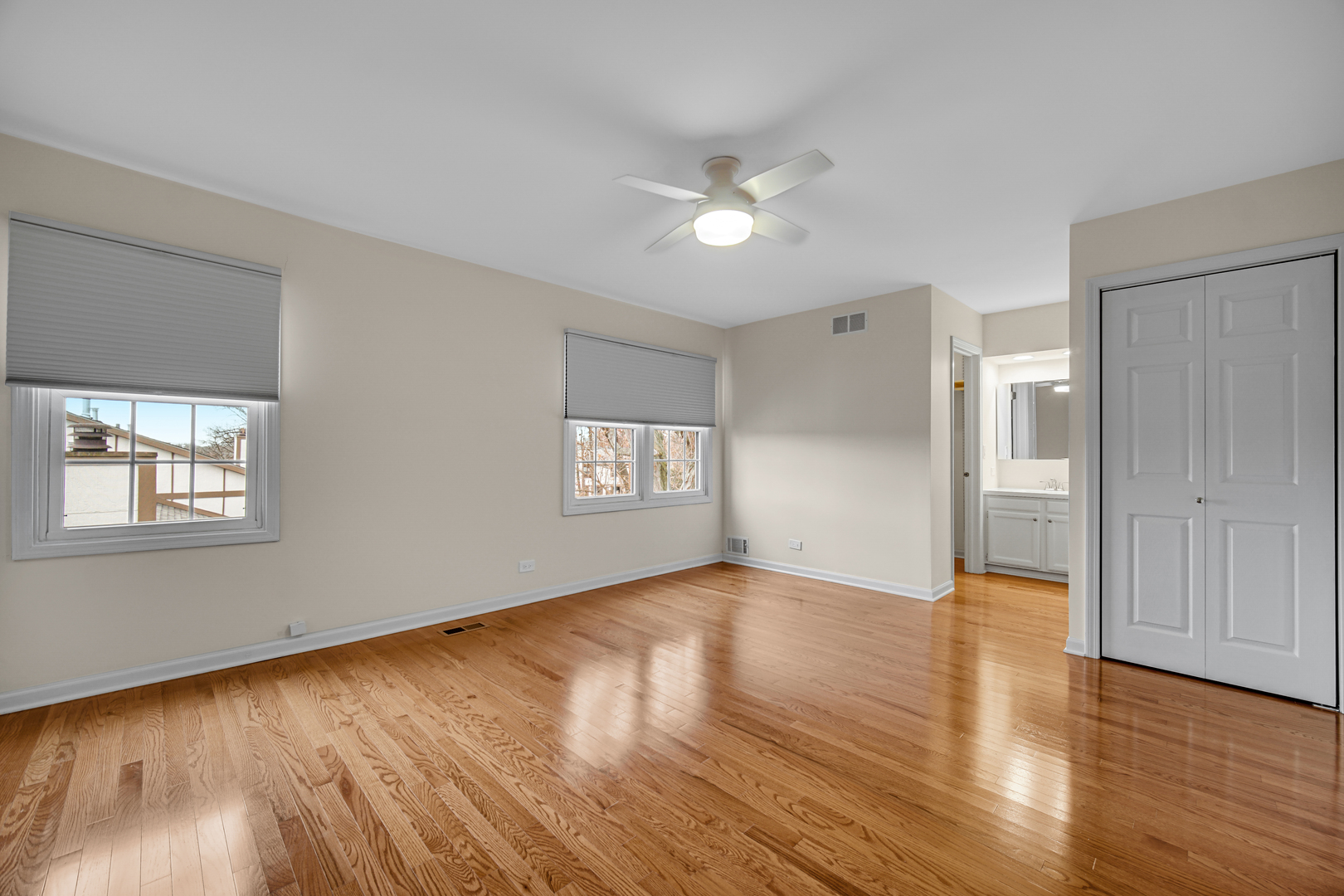 1130 Oakview Drive Wheaton, IL 60187 - Photo 17 of 25 a view of an empty room with wooden floor and a window