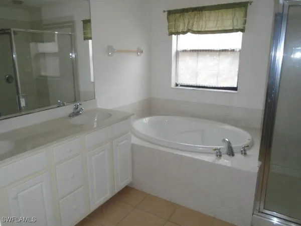 a bathroom with a bathtub and a sink