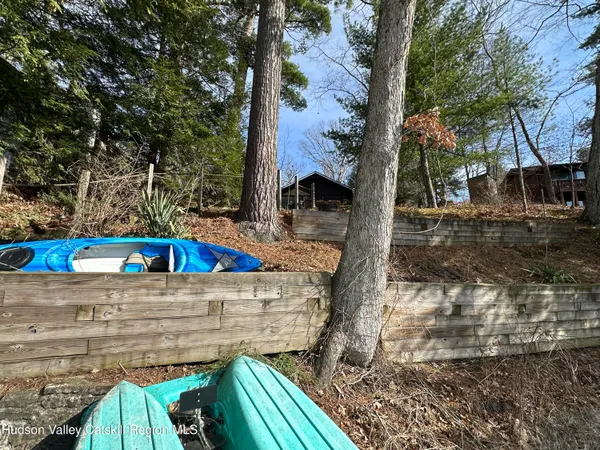 a kitchen with stainless steel appliances kitchen island a table and chair in it