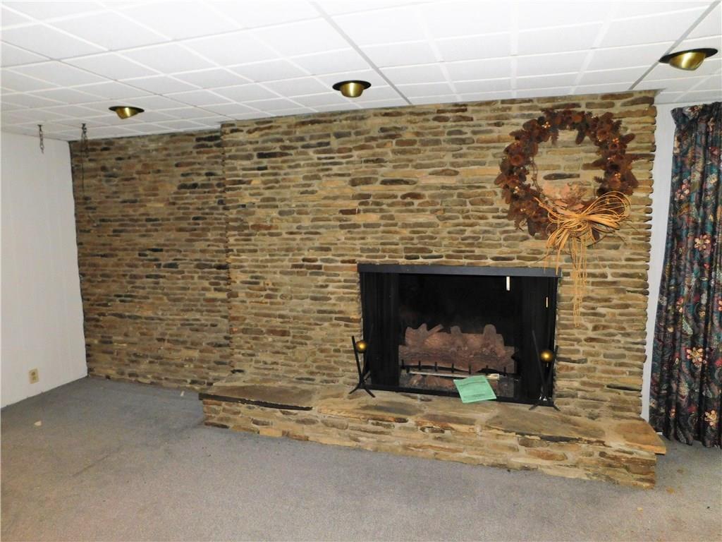 201 Chestnut Ridge Road Acme, PA 15610 - Photo 4 of 18 Cozy up on cold winter nights by this large brick fireplace.