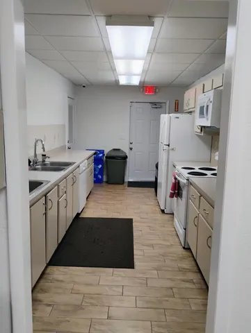 a room with table chairs and flat screen tv
