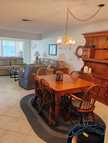 a bedroom with a bed and next to a window