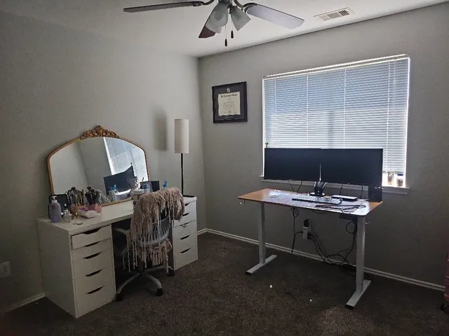 a view of a workspace with furniture