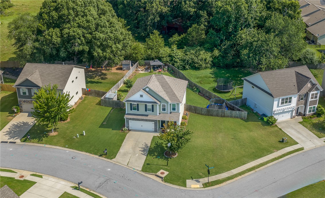 719 Camberwell Road Simpsonville, SC 29680 - Photo 35 of 47 Mature trees frame the spacious suburban property situated on an appealing corner lot.