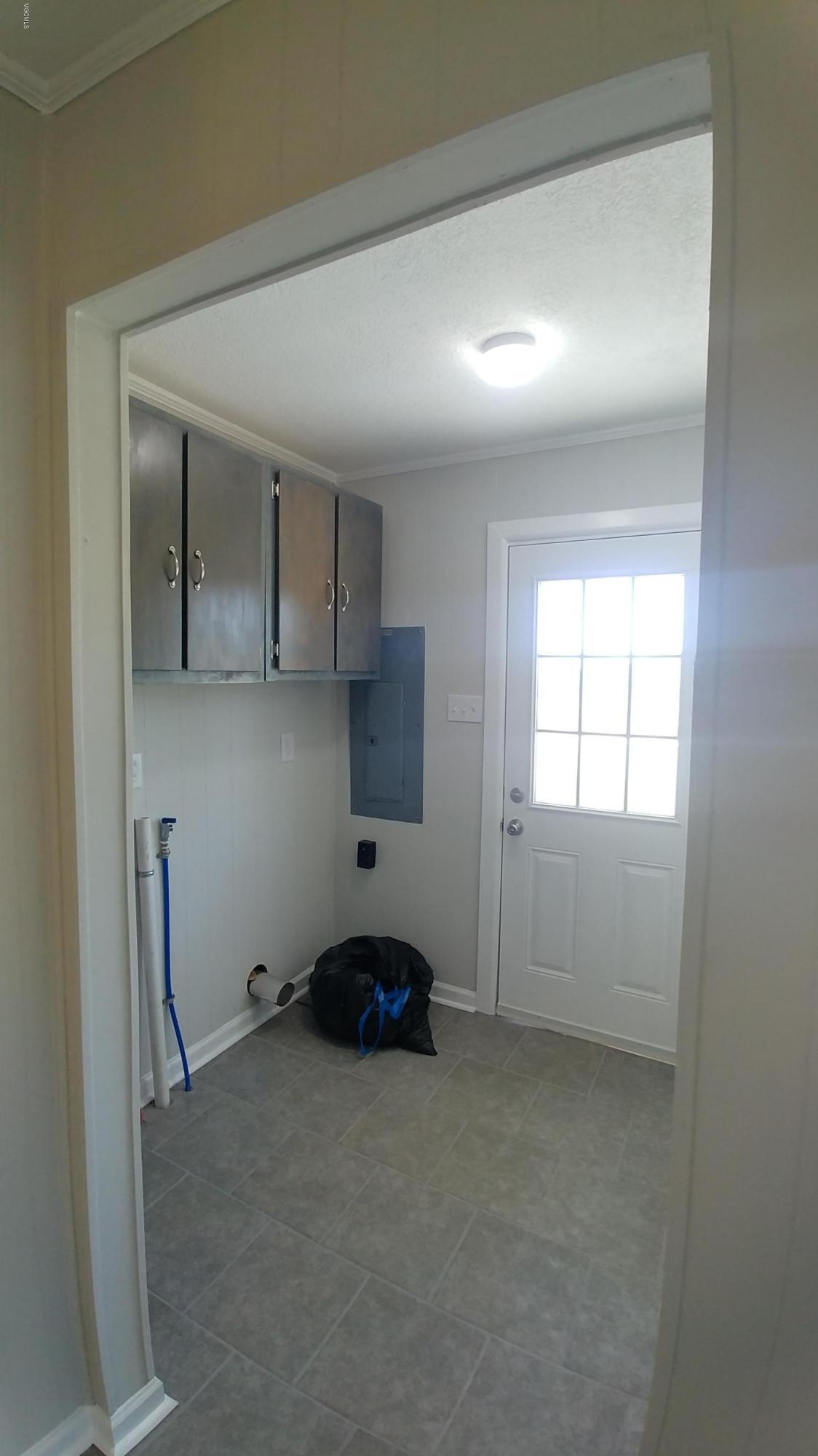 7 Pipeline Road Perkinston, MS 39573 - Photo 22 of 29 Utility Room Side Entrance