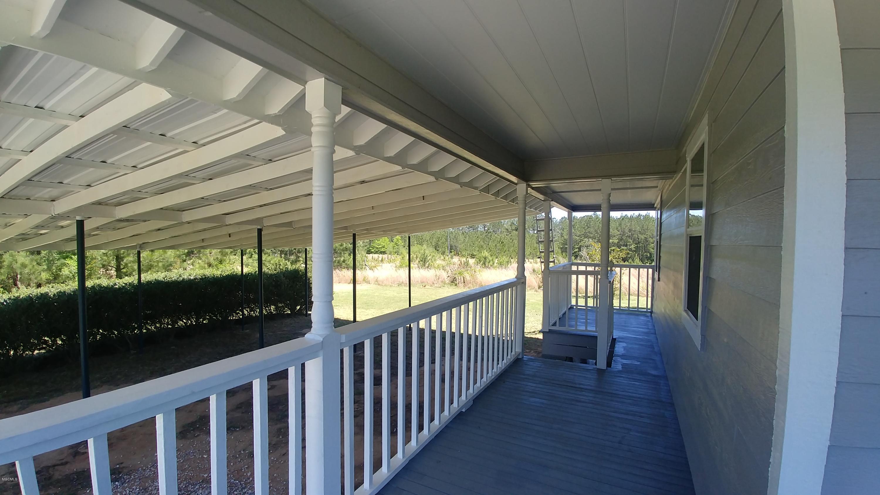 7 Pipeline Road Perkinston, MS 39573 - Photo 5 of 29 Wrap around side porch