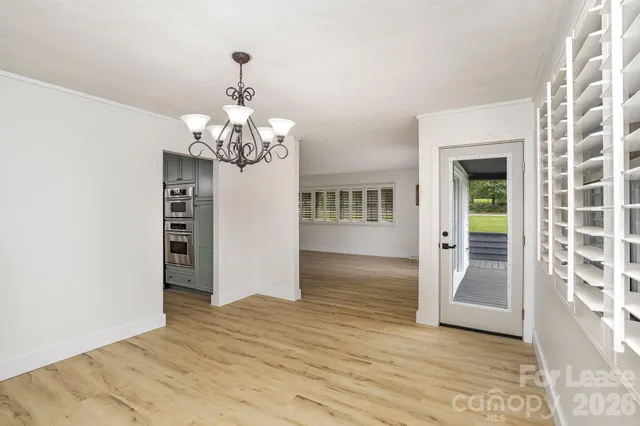 a view of a living room and hardwood floor