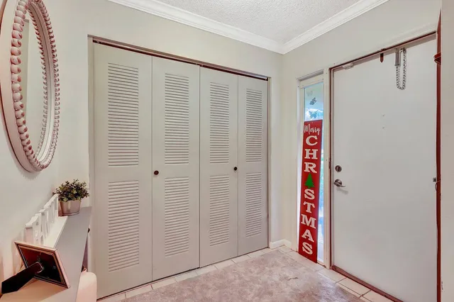 a view of a hallway with entryway door