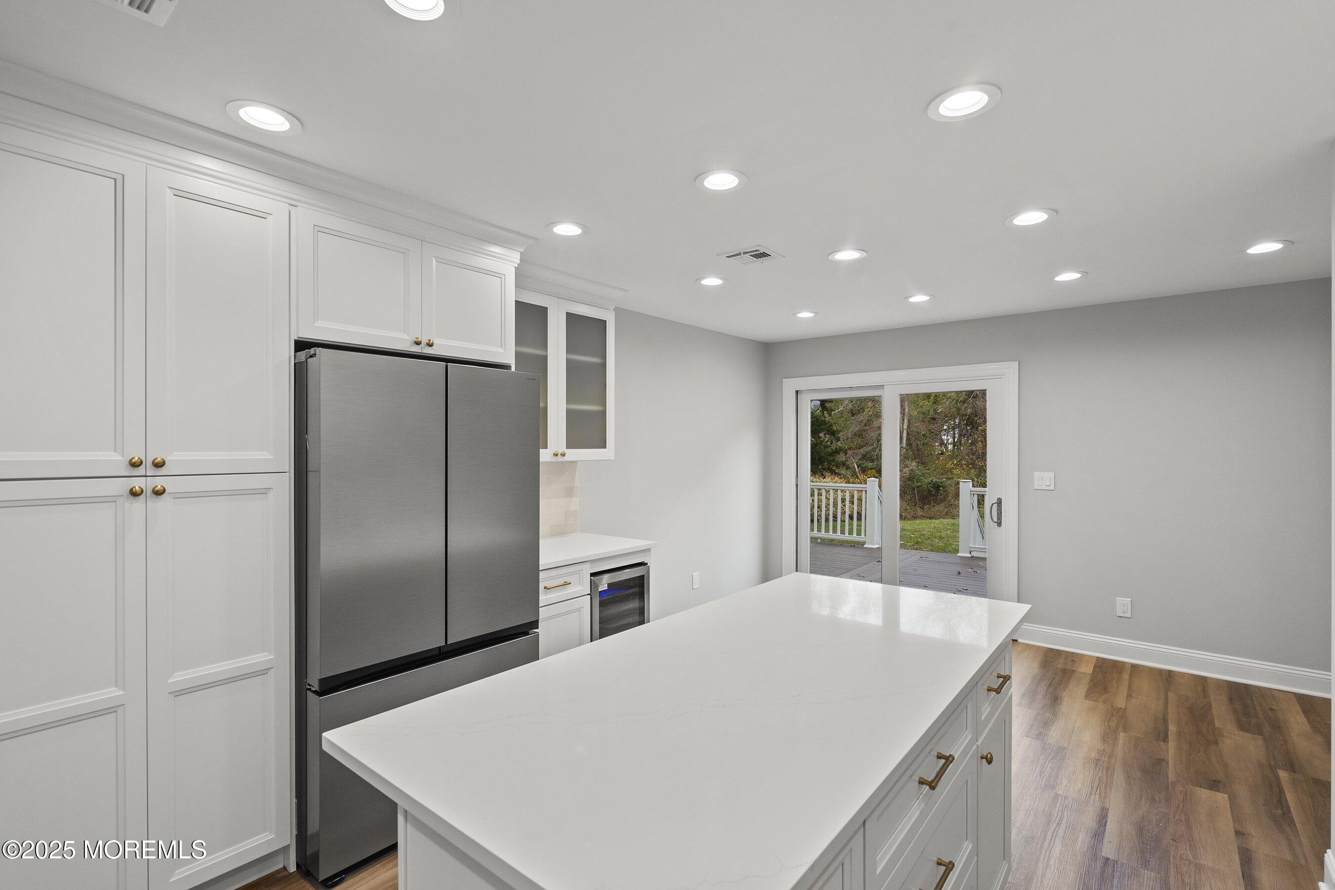 122 West 6th Street Howell, NJ 07731 - Photo 5 of 16 a kitchen with stainless steel appliances a refrigerator and a sink