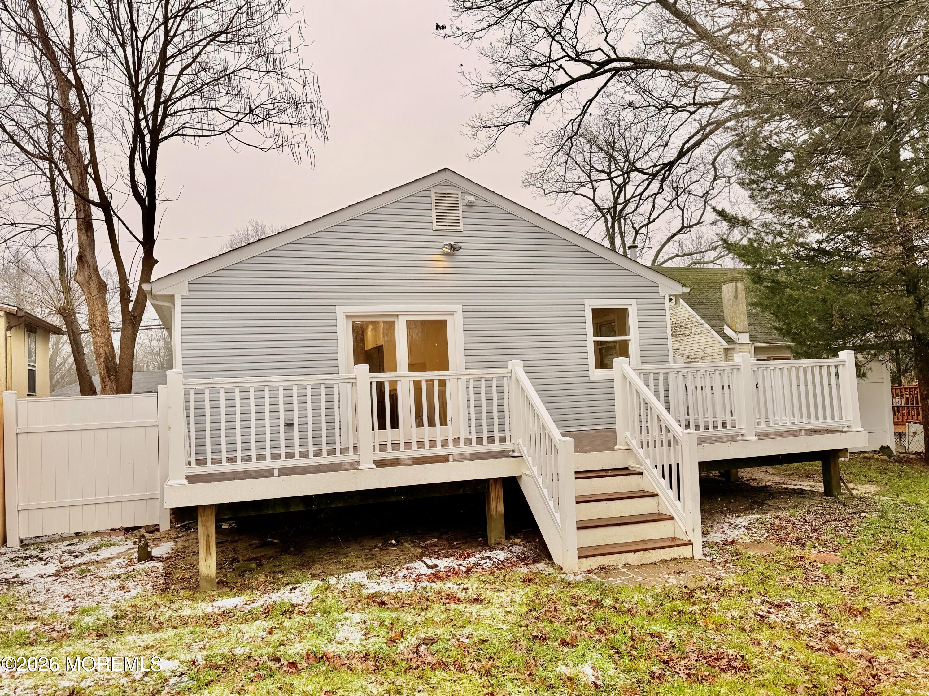 122 West 6th Street Howell, NJ 07731 - Photo 8 of 20 a view of a house with a wooden deck