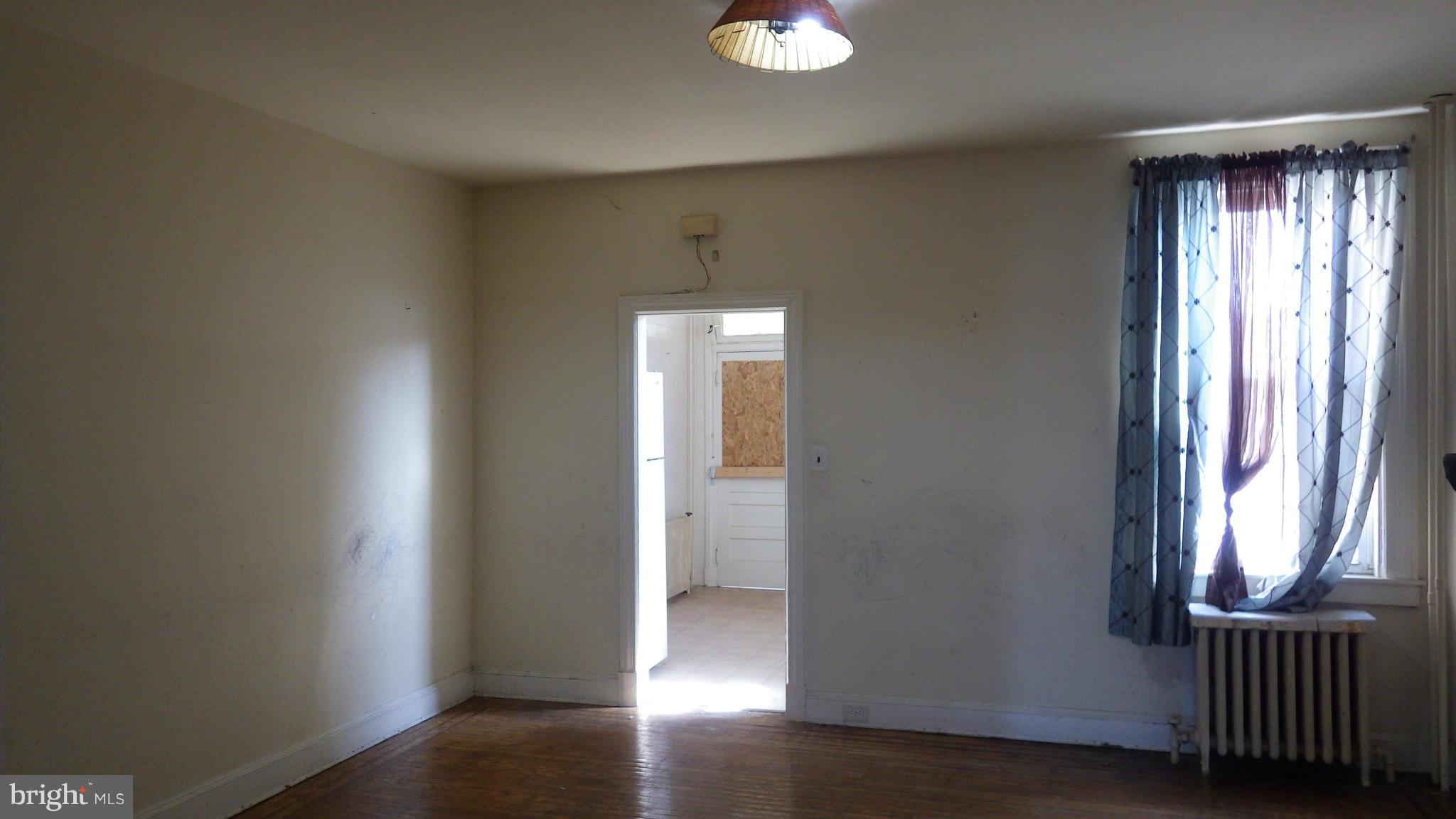 6055 Harford Road Baltimore, MD 21214 - Photo 3 of 13 an entryway with a window
