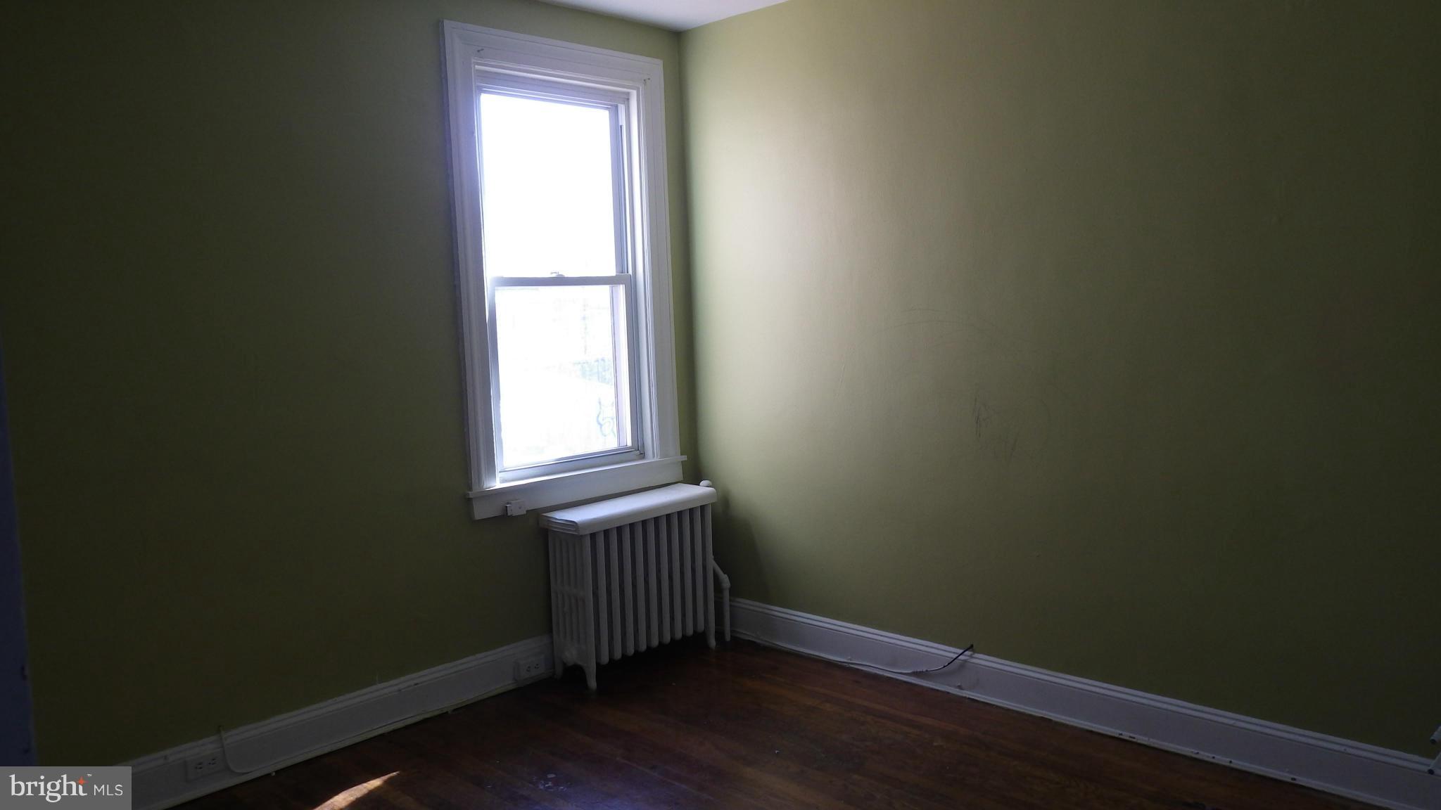 6055 Harford Road Baltimore, MD 21214 - Photo 10 of 13 a view of an empty room with a window