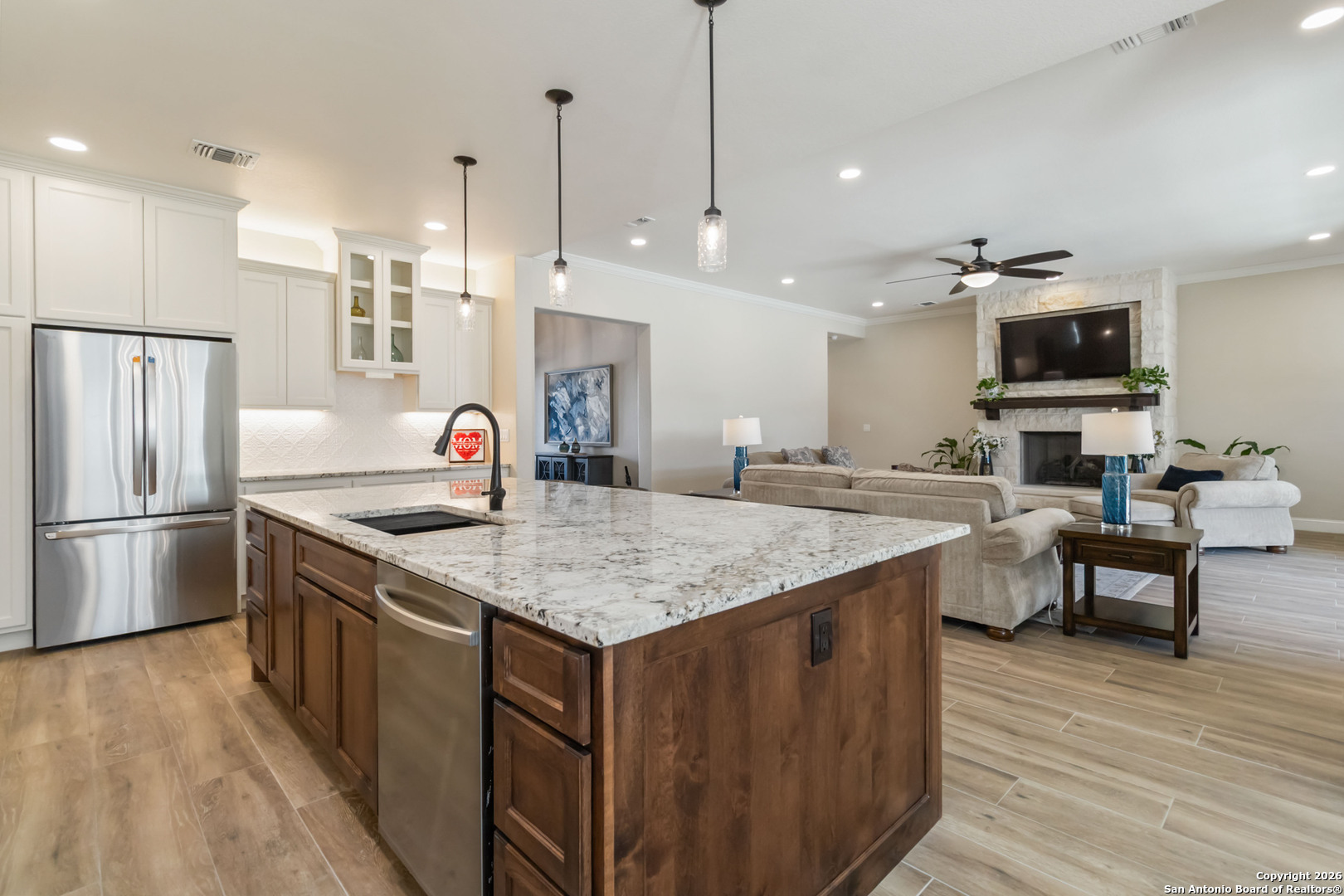 43 Lost Valley Boerne, TX 78006 - Photo 13 of 61 a kitchen with stainless steel appliances granite countertop a sink stove and refrigerator