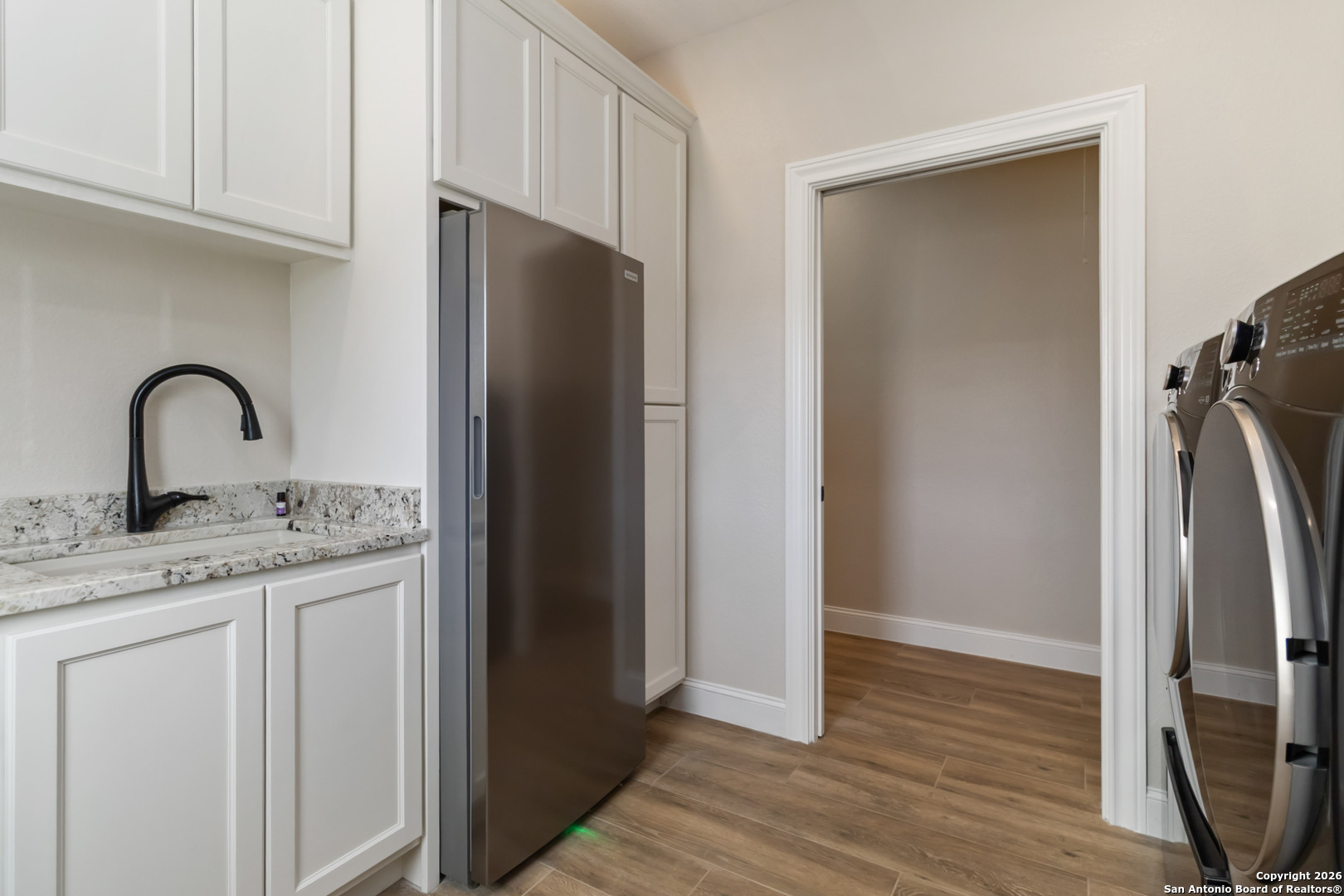 43 Lost Valley Boerne, TX 78006 - Photo 19 of 61 a kitchen with a refrigerator and a sink
