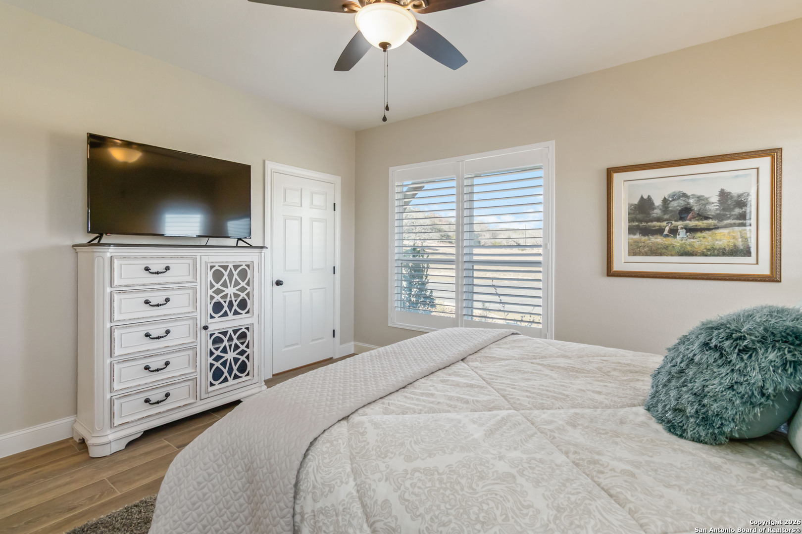 43 Lost Valley Boerne, TX 78006 - Photo 30 of 61 a bedroom with a large bed and a flat screen tv