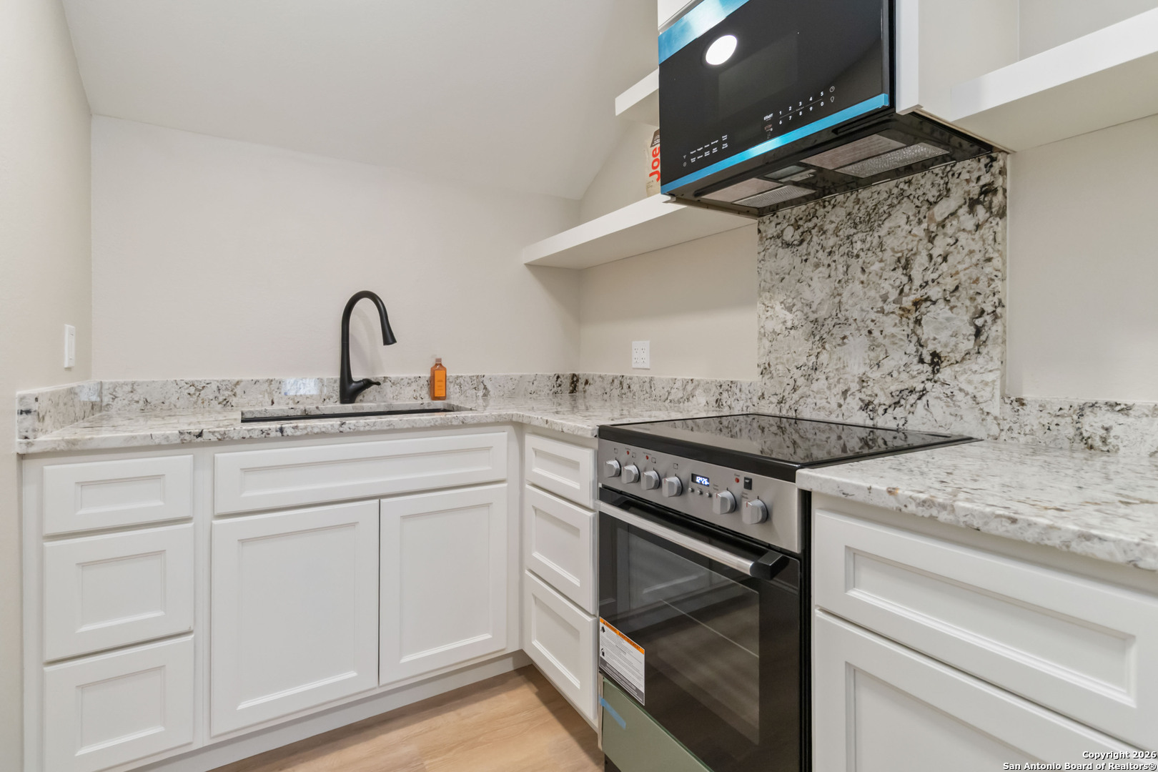43 Lost Valley Boerne, TX 78006 - Photo 38 of 61 a kitchen with granite countertop white cabinets and appliances