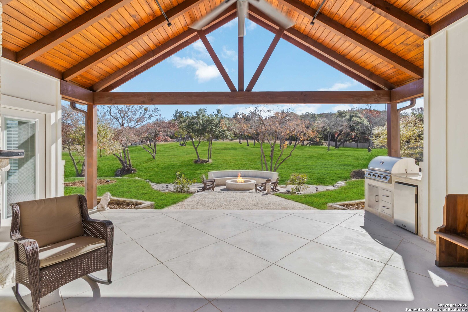 43 Lost Valley Boerne, TX 78006 - Photo 42 of 61 a view of a patio with a table chairs and a yard