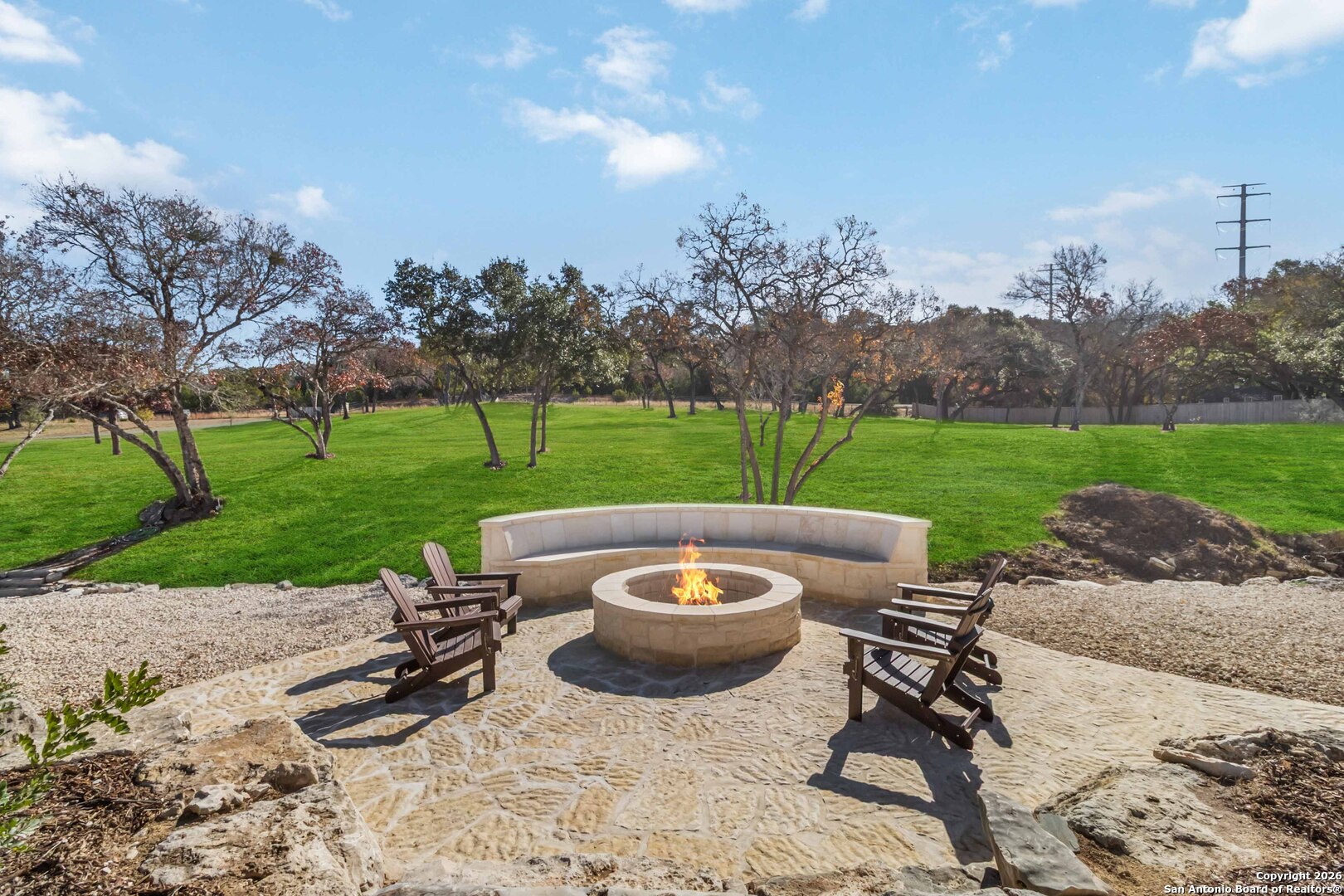 43 Lost Valley Boerne, TX 78006 - Photo 43 of 61 a view of a backyard with sitting area and outdoor kitchen