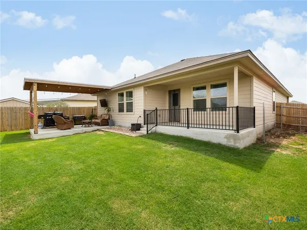 a view of a backyard with a patio