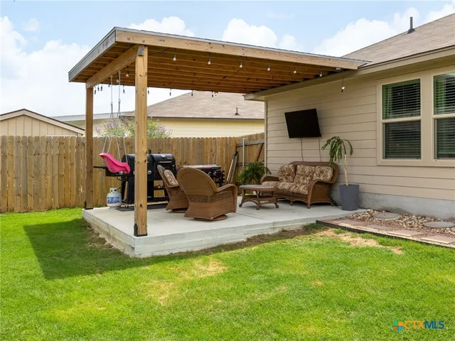 a outdoor living space with furniture and garden view
