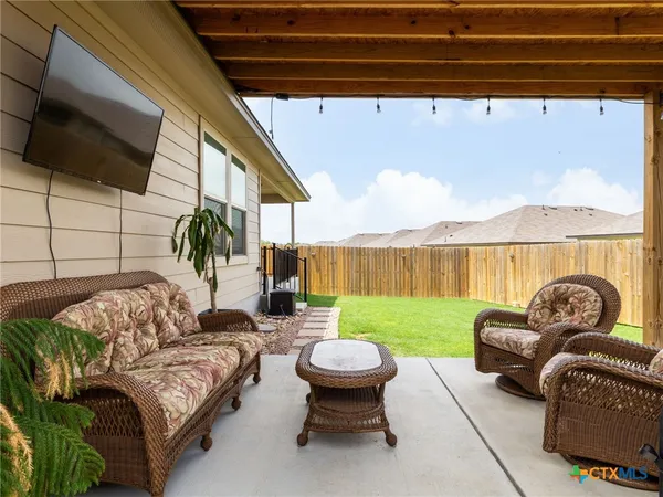 a view of a house with backyard and a slide