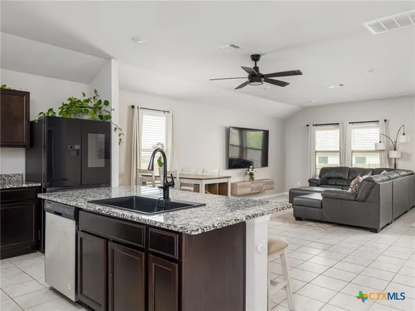 a view of living room with granite countertop furniture and fireplace