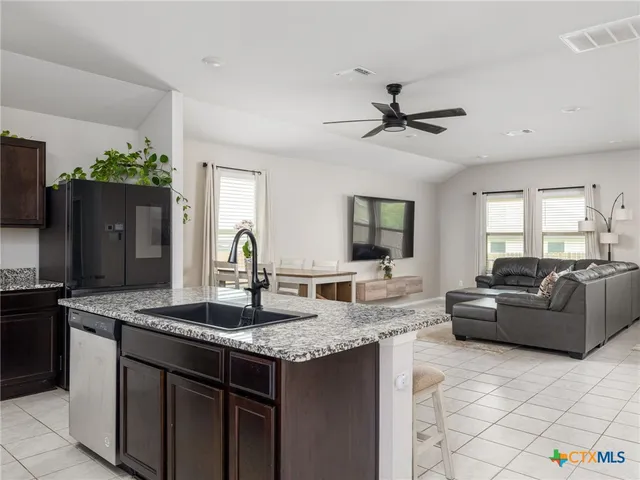 a view of living room with granite countertop furniture and fireplace