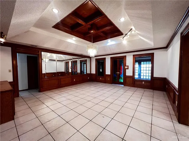 a view of an empty room with furniture and garage