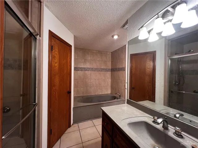 a bathroom with a sink a vanity and a mirror
