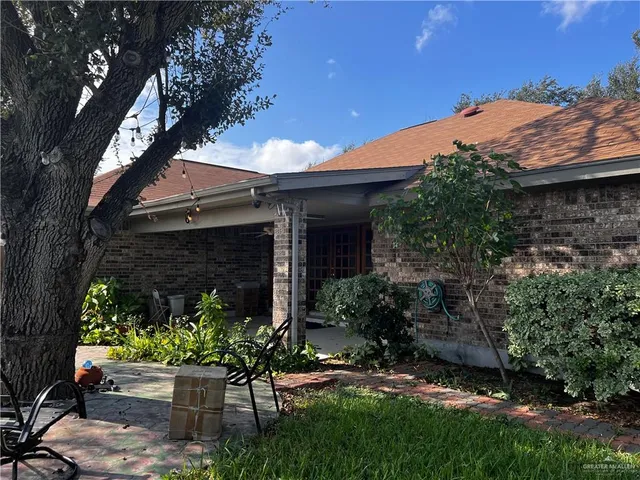 a backyard of a house with lots of green space