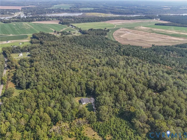 a aerial view of a house with a yard