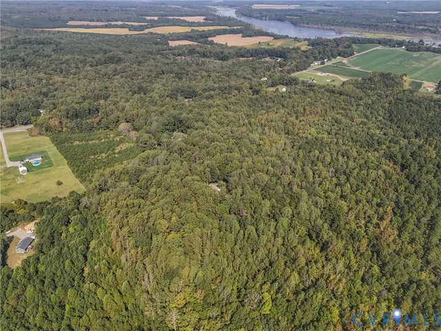 a aerial view of a house with a yard